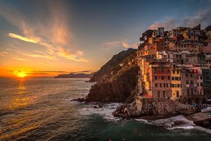Riomaggiore Sunset Rolling Waves Beautiful sunset light and gentle waves create a memorable scene in Riomaggiore